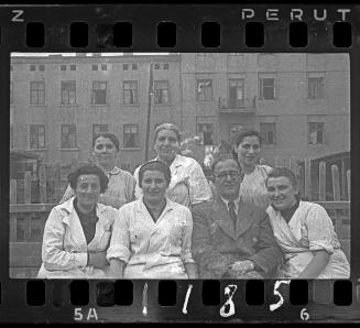 Group portrait of Dr. Kagan with female hospital staff
