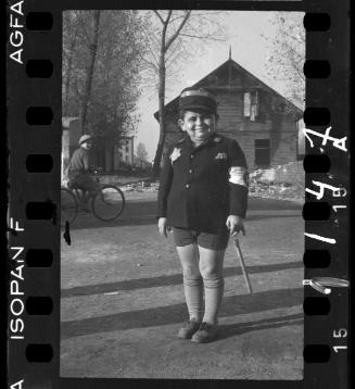 Child dressed as ghetto policeman