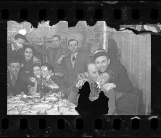 Jewish policeman celebrating with friends