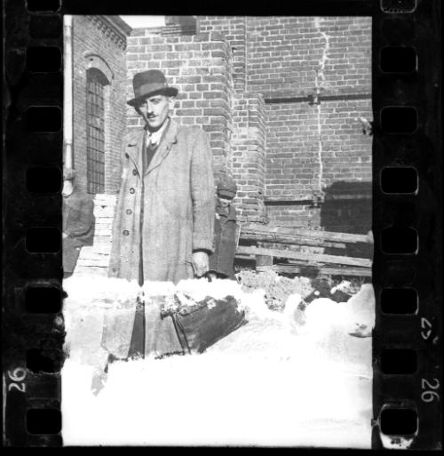 Portrait of Henryk Ross, holding a briefcase, in the ghetto