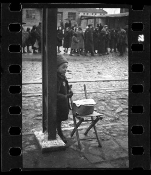 Young boy selling foodstuff on the street
