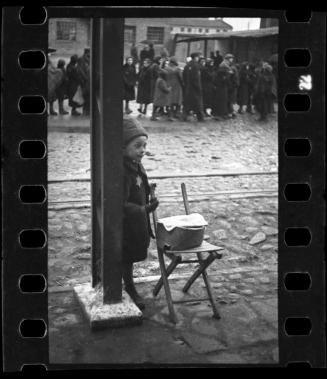 Young boy selling foodstuff on the street
