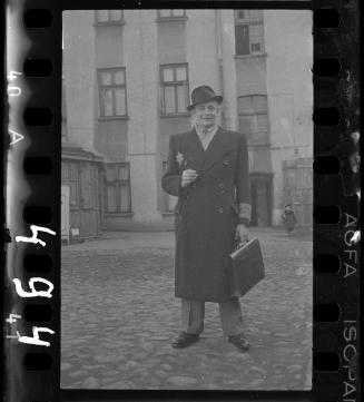 A well-dressed ghetto official