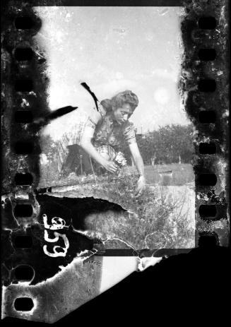 Portrait of Stefania Schoenberg picking flowers