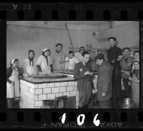 Administrator and workers in the kitchen