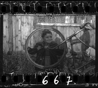 Portrait of a boy with a bike