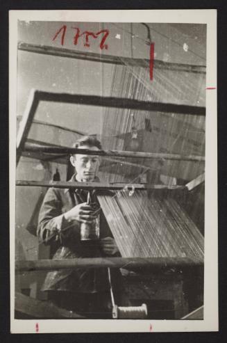 Man at loom in the textile department, Lodz Ghetto