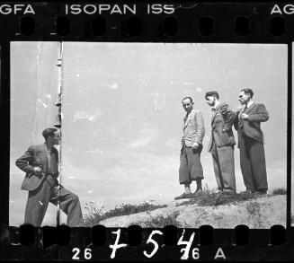 Four male ghetto residents posing