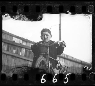 Portrait of a boy with a bike
