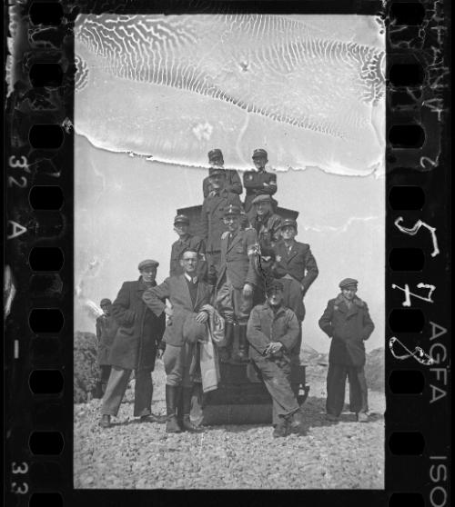 Group portrait of Jewish policemen and administrators at a worksite