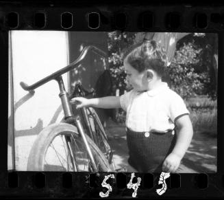 Portrait of a young boy with a bike