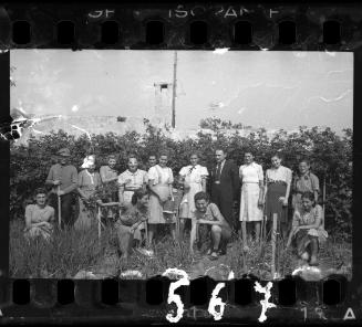 Group portrait of ghetto residents in a garden