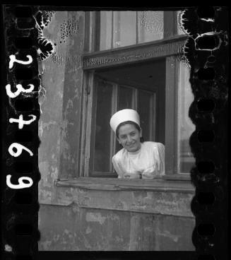 Nurse smiling in the window