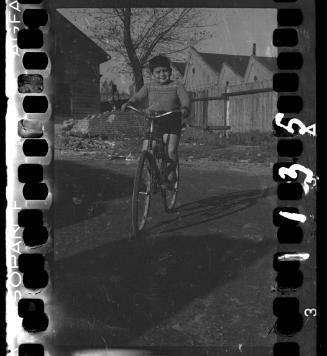 Portrait of a boy on a bike