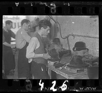 Workers in the hat workshop