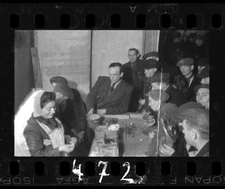 Administrator overseeing distrubtion of food in the kitchen