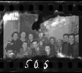 Group of residents at a dinner party in the ghetto