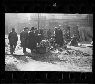 Residents selling furniture and wooden scraps for firewood