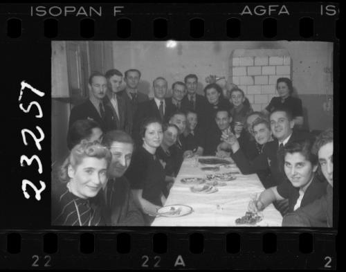 Large group of residents gathered around a dinner table