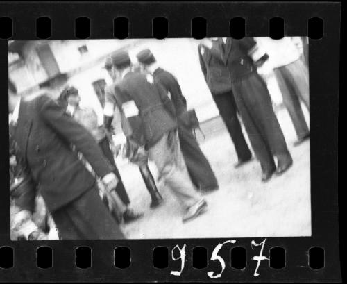 Uniformed personnel (probably postal workers) in the ghetto