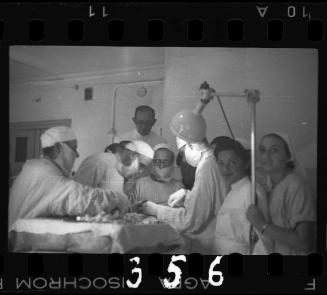 Doctors performing surgery on baby