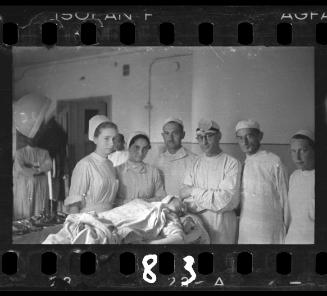 Doctors and nurses with patient