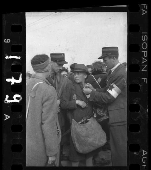 Ghetto resident being tagged by ghetto police for deportation