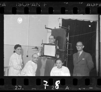 Doctors with x-ray machine