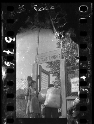 Residents walking through prison gate on Czarnecki Street prior to deportation