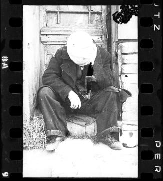 Man sitting in a doorway