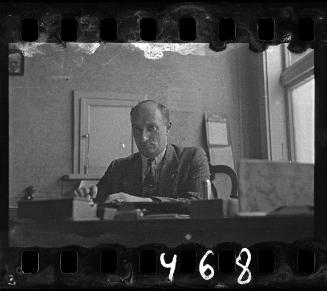 Portrait of an administrator sitting at his desk