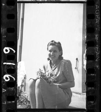 Young woman holding a bouquet of flowers