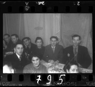 Residents at a wedding reception in the ghetto