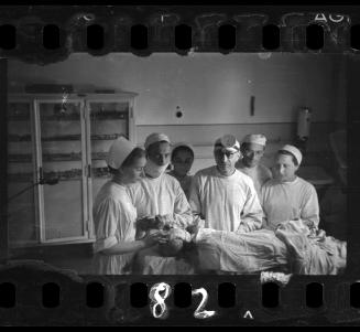 Doctors and nurses with patient