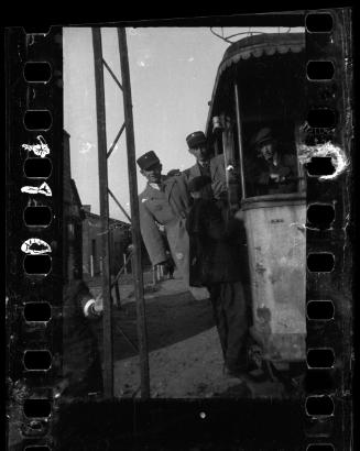 Two Jewish policemen and two men on a streetcar