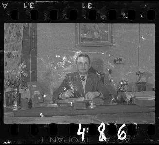 Administrator sitting at his desk
