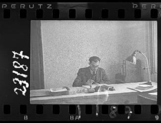 An administrator working at his desk