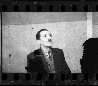 Portrait of Henryk Ross looking away from camera