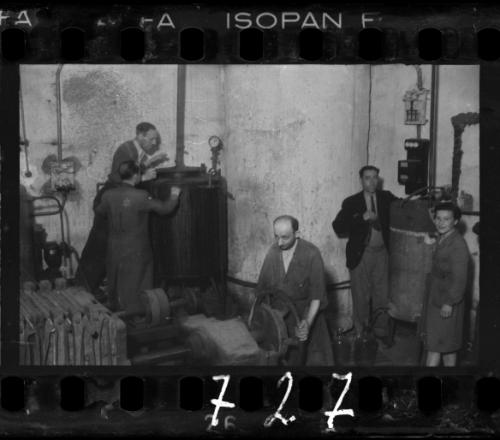 Men and women working in a factory