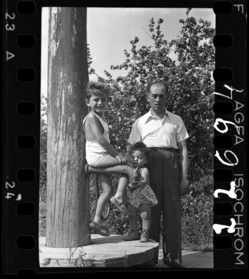 A man with a boy and a baby