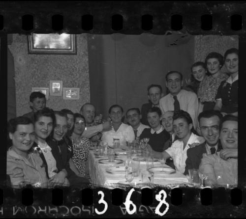 Residents gathered around the table at a dinner party