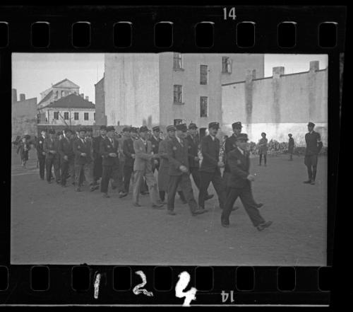 Jewish policemen marching through the ghetto