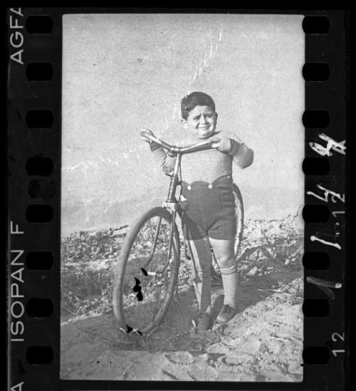 Portrait of a boy with a bike