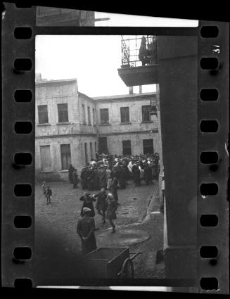 Crowd of residents gathered in a courtyard