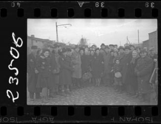 Large group of residents gathered in the street