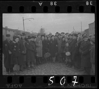 Large group of residents gathered in the street