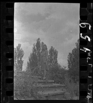 Portrait of Stefania Schoenberg standing on steps in the garden