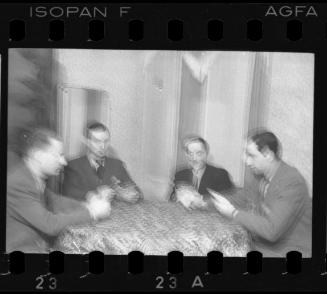 Portrait of four men around the table
