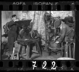 Two men working in a factory