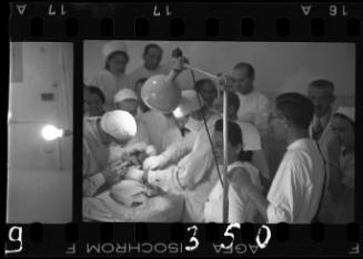 Doctors performing surgery on baby